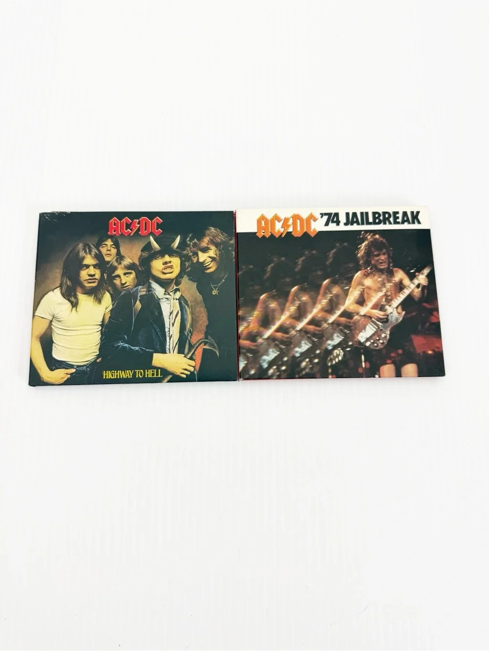 Set of 2 2003 AC/DC Remastered Music CDs Epic Jailbreak Highway to Hell
